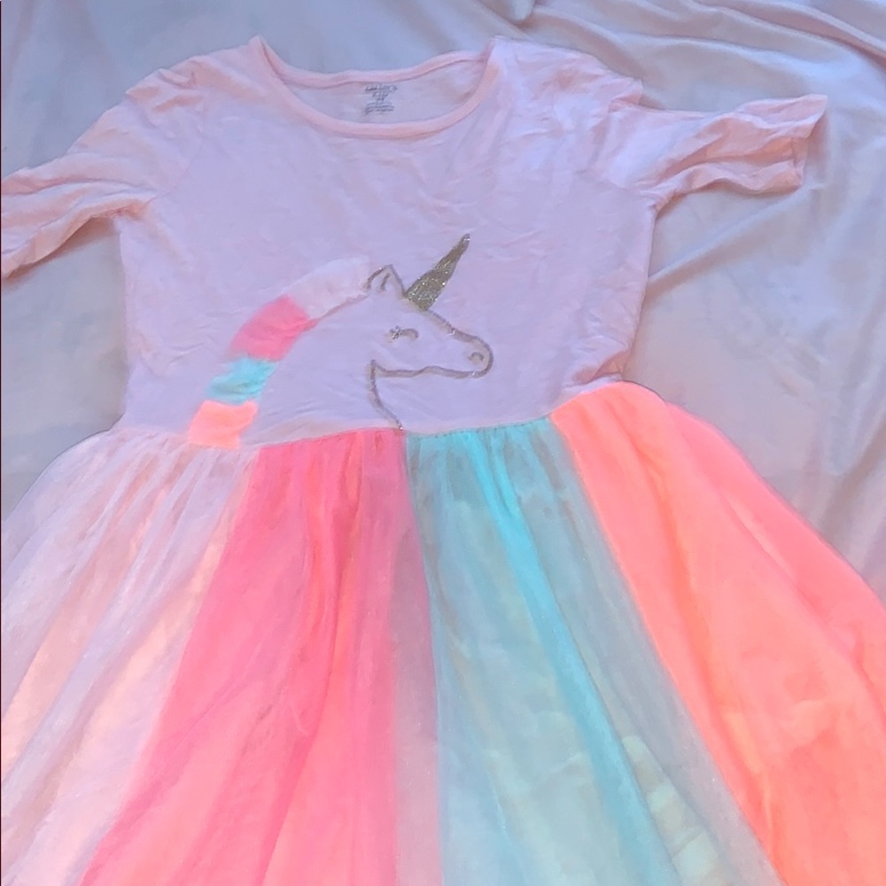 I am selling a unicorn dress for $25 size 14